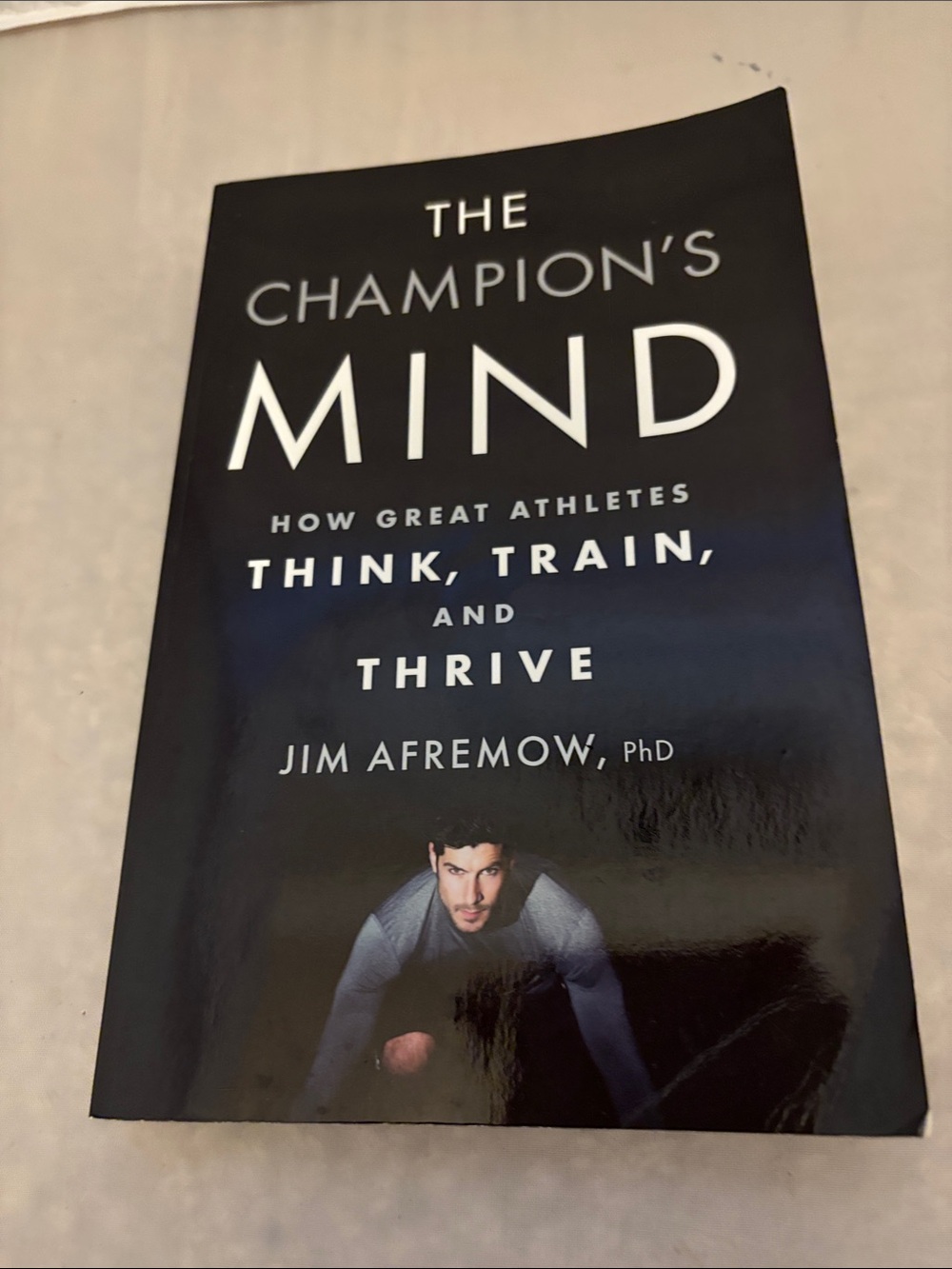 The Champion's Mind: How Great Athletes Think, Train, and Thrive  Paperback Book